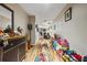 Long hallway with decorative rug and storage at 650 Lakes Cir, Lithonia, GA 30058