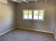 Bright bedroom with new carpet and large windows at 2183 Elizabeth Se Ave, Smyrna, GA 30080