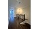 Upstairs hallway with hardwood flooring and railing at 617 Brennan Dr, Decatur, GA 30033