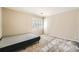 Small bedroom with full-size bed and carpeted floor at 2958 Applewood Ne Ct, Atlanta, GA 30345