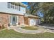 Brick front of house with a double garage and a blue front door at 2958 Applewood Ne Ct, Atlanta, GA 30345