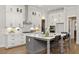 Spacious kitchen with white cabinets, large island, and stainless steel appliances at 3759 Tielman St, Snellville, GA 30078