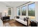 Bedroom sitting area features a comfy white couch and large windows at 3759 Tielman St, Snellville, GA 30078