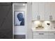 Elegant kitchen detail showcasing a farmhouse-style sliding door and artwork at 3759 Tielman St, Snellville, GA 30078