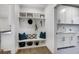 Convenient laundry room with built-in bench and cabinets at 3759 Tielman St, Snellville, GA 30078
