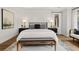 Main bedroom with a king-size bed, nightstands, and a neutral color scheme at 3759 Tielman St, Snellville, GA 30078