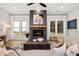 Living area featuring a fireplace and comfortable seating area with natural light at 3759 Tielman St, Snellville, GA 30078