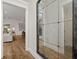 Hallway with hardwood floors and large mirror at 3759 Tielman St, Snellville, GA 30078