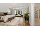 Spacious main bedroom with a king-size bed and sitting area at 3759 Tielman St, Snellville, GA 30078