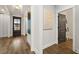 Hardwood floor entry hall with gray door to a bedroom at 3759 Tielman St, Snellville, GA 30078