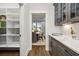 Walk-in pantry with ample shelving for storage at 3759 Tielman St, Snellville, GA 30078
