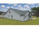 Side view of a gray house with a covered patio and backyard at 3759 Tielman St, Snellville, GA 30078