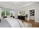 Main bedroom with a king-size bed, plenty of natural light, and a sitting area at 3759 Tielman St, Snellville, GA 30078