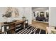 Home office with built-in shelving and view of dining area at 3759 Tielman St, Snellville, GA 30078