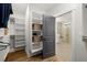 Large walk-in closet with built-in shelving and a view of the bathroom at 3759 Tielman St, Snellville, GA 30078