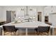 Modern kitchen featuring a large island with quartz countertop and bar seating at 3759 Tielman St, Snellville, GA 30078