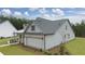 Side view of a gray house with a two car garage at 3759 Tielman St, Snellville, GA 30078