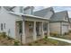Brick and siding house exterior with a covered porch at 3759 Tielman St, Snellville, GA 30078
