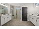 Modern bathroom boasts double vanities, a large shower, and stylish fixtures at 3759 Tielman St, Snellville, GA 30078