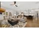 Open concept living room with kitchen and island visible in the background at 3759 Tielman St, Snellville, GA 30078