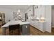 Bright kitchen boasts white cabinets, quartz countertops, and a large island at 3759 Tielman St, Snellville, GA 30078