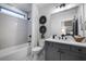 Modern bathroom with subway tile, a vanity, and a shower/tub combo at 3759 Tielman St, Snellville, GA 30078