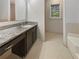 Bathroom with granite vanity and hexagon tile floor at 8683 Twin Oaks Dr, Jonesboro, GA 30236