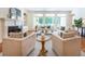 Elegant living room with hardwood floors, fireplace, built-in shelving and natural light at 3993 N Ivy Ne Rd, Atlanta, GA 30342