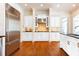 Bright kitchen featuring white cabinets and hardwood floors at 3993 N Ivy Ne Rd, Atlanta, GA 30342