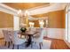 Formal dining room with hardwood floors, a chandelier, and stylish decor at 3993 N Ivy Ne Rd, Atlanta, GA 30342