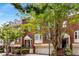 Brick townhomes with lush landscaping and American flags at 3685 Peachtree Ne Rd # 4, Atlanta, GA 30319