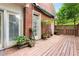 Brick home with a deck featuring multiple potted plants at 3685 Peachtree Ne Rd # 4, Atlanta, GA 30319