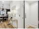 Hallway showcasing a home elevator and stylish console table at 109 Cumming St, Alpharetta, GA 30009