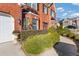 Front entry of brick home with walkway and manicured landscaping at 360 Darkwater Sw Ct, Atlanta, GA 30331