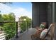 Relaxing balcony with wicker chairs and city views at 437 Parkway Ne Dr, Atlanta, GA 30308