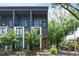 Modern three-story home with orange accents and landscaped yard at 437 Parkway Ne Dr, Atlanta, GA 30308