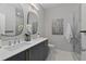 Spa-like bathroom with dual vanity, walk-in shower, and modern fixtures at 437 Parkway Ne Dr, Atlanta, GA 30308