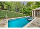 Refreshing in-ground pool with integrated spa and spacious patio at 1015 Nawench Dr, Atlanta, GA 30327