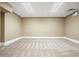 Spacious carpeted basement room with neutral walls at 5955 Tibor Nw Dr, Acworth, GA 30101