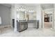Elegant bathroom with marble flooring and a large vanity at 5955 Tibor Nw Dr, Acworth, GA 30101