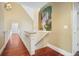 Upper hallway with hardwood floors and painted mural at 5955 Tibor Nw Dr, Acworth, GA 30101