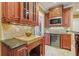 Kitchen features granite countertops, stainless steel appliances, and custom cabinetry at 5955 Tibor Nw Dr, Acworth, GA 30101