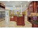 Island kitchen with granite countertops, stainless steel appliances, and custom cabinetry at 5955 Tibor Nw Dr, Acworth, GA 30101