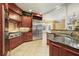 Spacious kitchen with stainless steel appliances and custom cabinetry at 5955 Tibor Nw Dr, Acworth, GA 30101