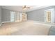 Bright living room with neutral carpeting and access to backyard at 5955 Tibor Nw Dr, Acworth, GA 30101