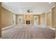Spacious living room with fireplace and neutral carpeting at 5955 Tibor Nw Dr, Acworth, GA 30101