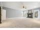 Spacious living room with fireplace and neutral carpeting at 5955 Tibor Nw Dr, Acworth, GA 30101