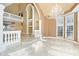 Two story living room with chandelier and tile floors at 5955 Tibor Nw Dr, Acworth, GA 30101