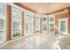 Bright sunroom with multiple windows and French doors at 5955 Tibor Nw Dr, Acworth, GA 30101