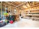 Unfinished basement with storage shelving and workbenches at 51 Riverbirch Way, Dallas, GA 30157